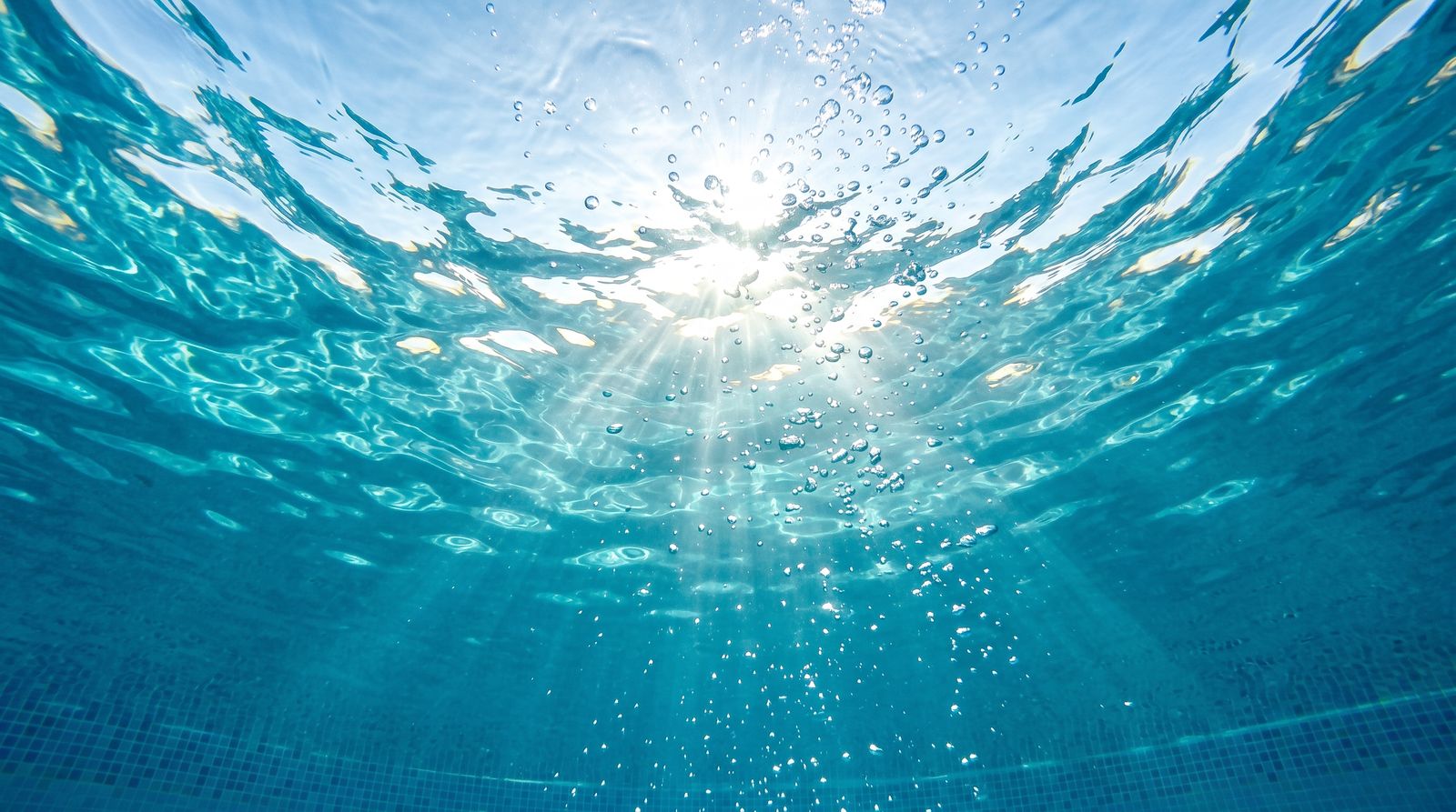 Sunlight streaming through pool water